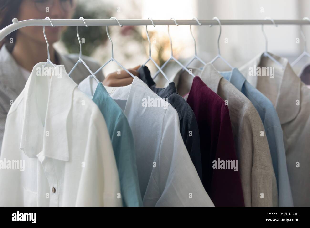 Exhibition samples of man shirts on hanger at atelier Stock Photo