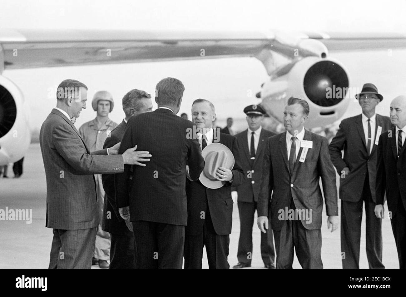 Inspection tour of NASA installations: Houston, Texas, arrival, 6:15PM. President John F. Kennedy (back to camera) greets Governor of Texas, Price Daniel, upon arrival at Houston International Airport, Houston, Texas. Left to right (in foreground): Representative Albert Thomas (Texas); Mayor of Houston, Lewis Cutrer; President Kennedy; Governor Daniel (holding hat, shaking hands with the President); Harris County Judge, Bill Elliott; unidentified; Director of the Manned Spacecraft Center, Dr. Robert Gilruth (partially hidden on edge of frame). President Kennedy traveled to Houston as part of a Stock Photo