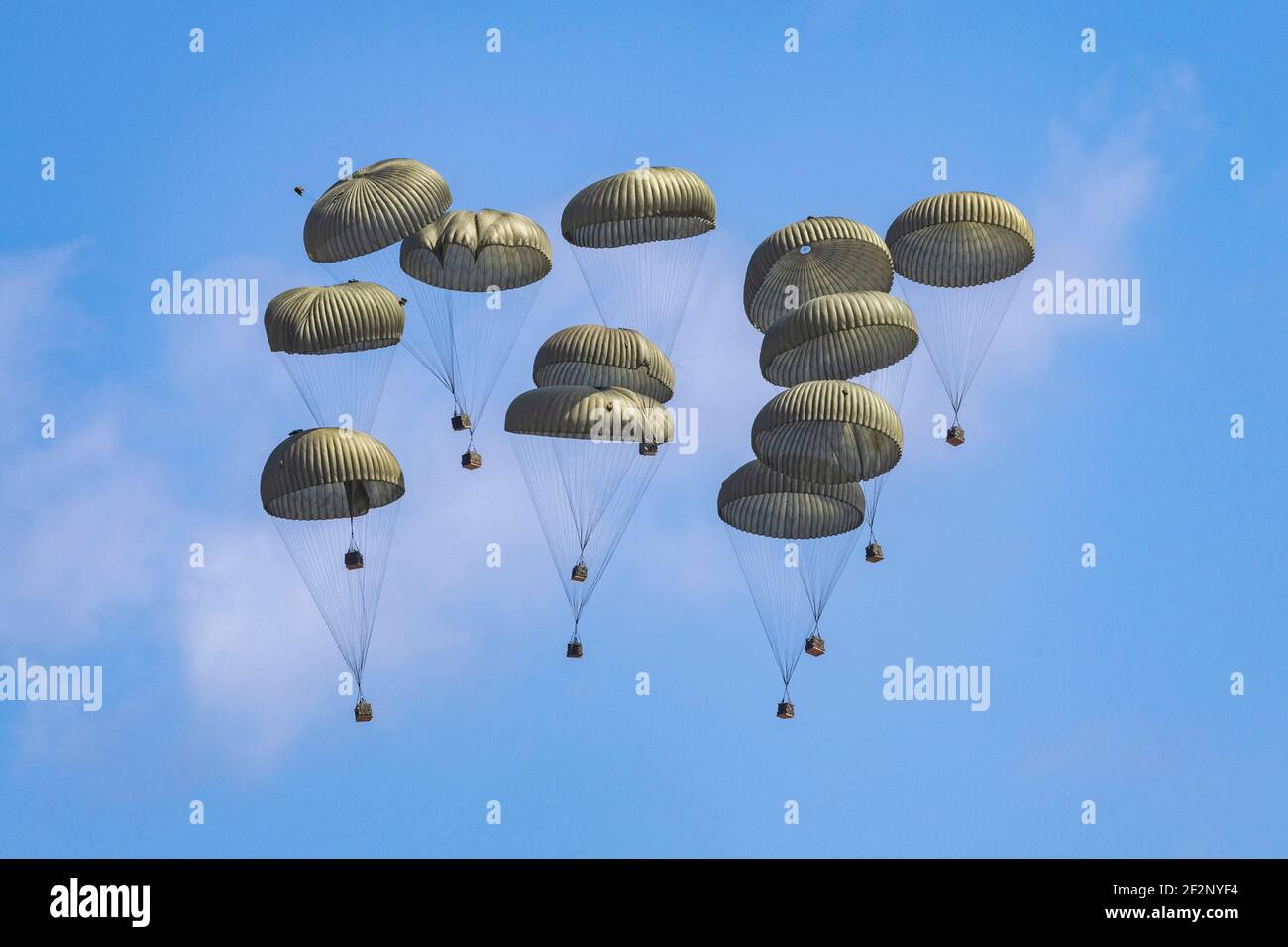 Gotemba, Japan. 11th Mar, 2021. Japan Ground Self-Defense Force Containerized Delivery System bundles drop from a U.S. Air Force C-130J Super Hercules aircraft during Exercise Airborne 21 at Camp Fuji March 11, 2021 near Gotemba, Japan. Exercise Airborne 21 is the largest U.S.- Japan airborne operation in history. Credit: Planetpix/Alamy Live News Stock Photo