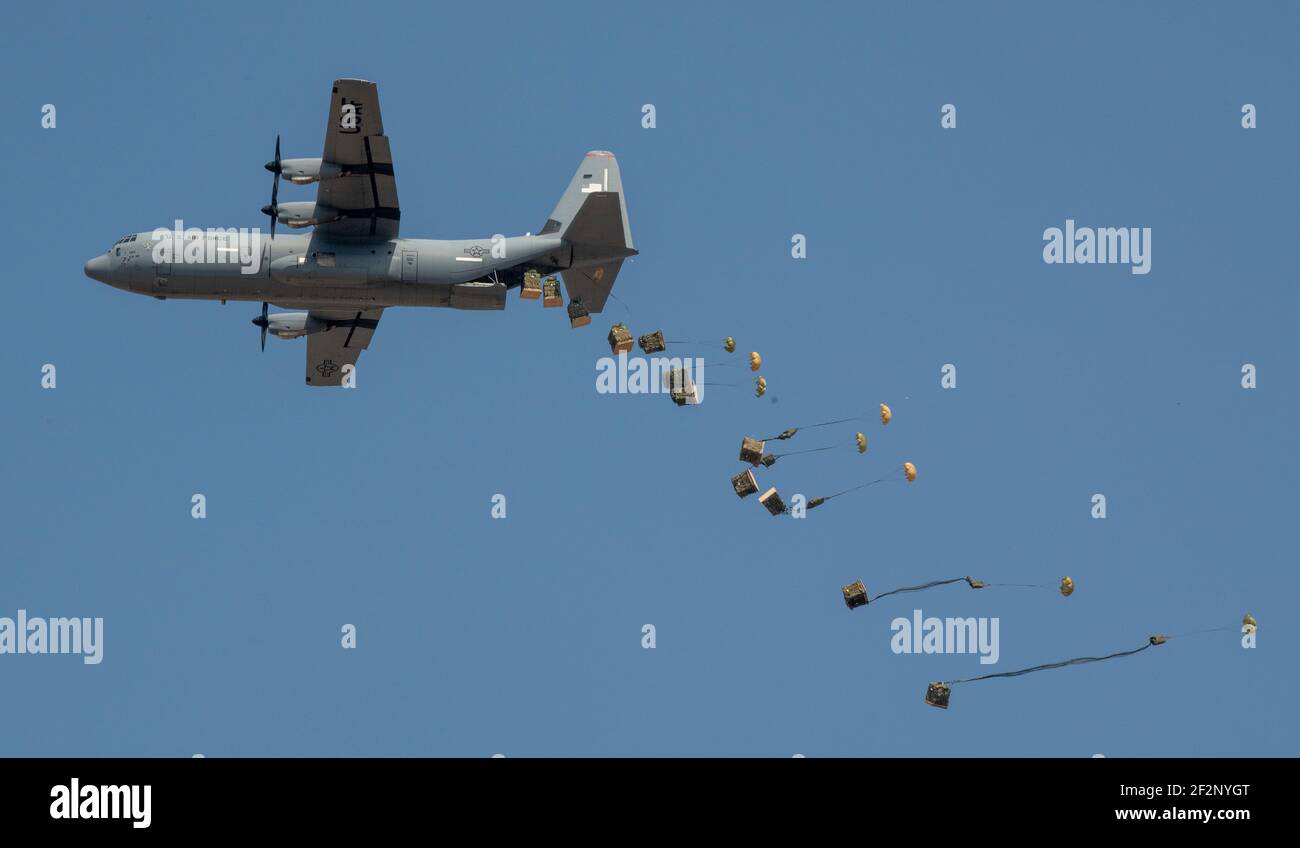 Gotemba, Japan. 11th Mar, 2021. Japan Ground Self-Defense Force Containerized Delivery System bundles drop from a U.S. Air Force C-130J Super Hercules aircraft during Exercise Airborne 21 at Camp Fuji March 11, 2021 near Gotemba, Japan. Exercise Airborne 21 is the largest U.S.- Japan airborne operation in history. Credit: Planetpix/Alamy Live News Stock Photo