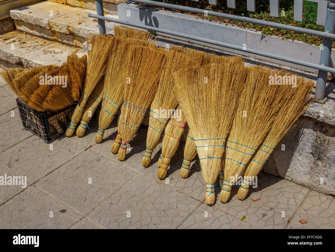 Handmade wicker brooms for sweeping made of sorghum for sale at street market Stock Photo