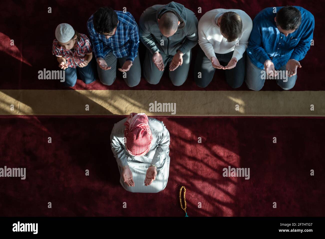 group of muslim people praying namaz in mosque. Stock Photo