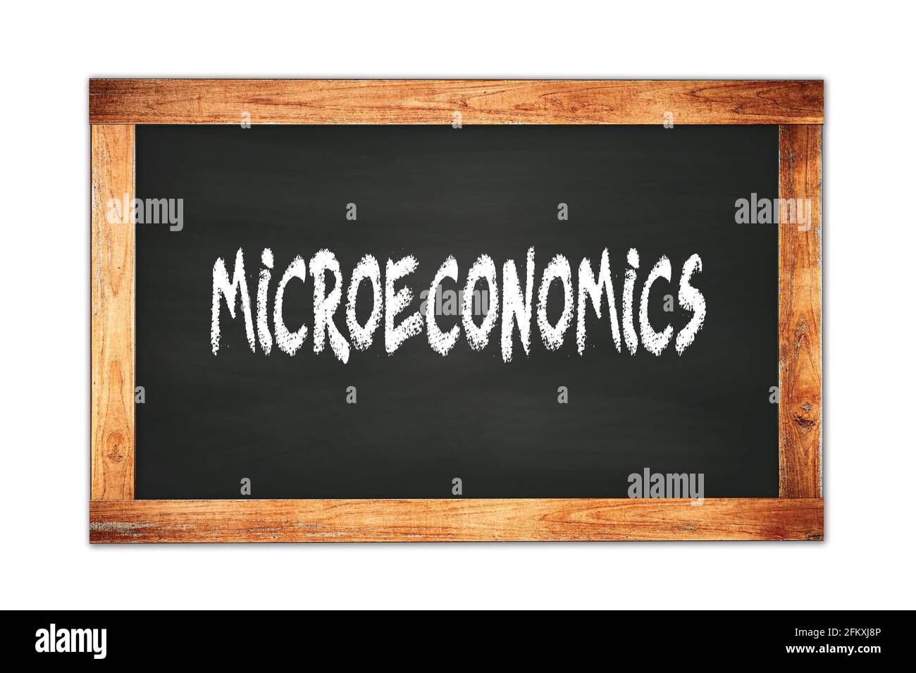 MICROECONOMICS text written on black wooden frame school blackboard. Stock Photo