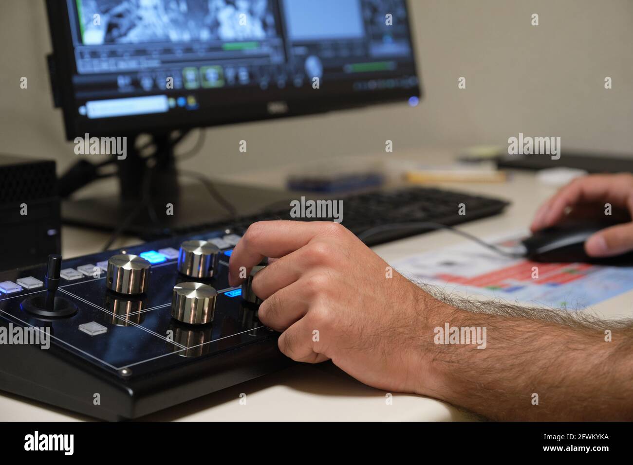 Unrecognizable scientist working with scanning electron microscope. Laboratory technician observing samples with a SEM. Stock Photo