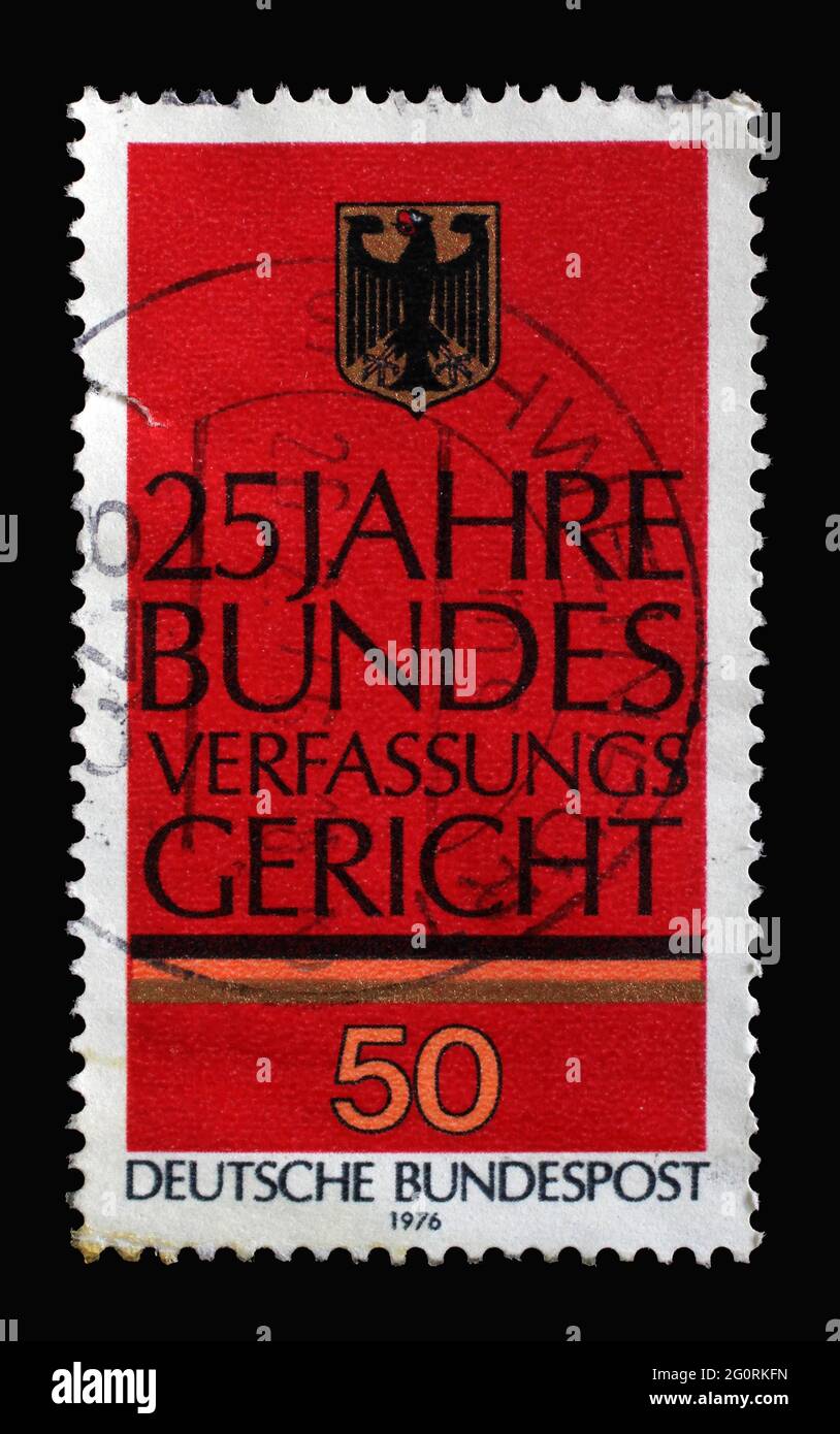 A stamp printed in Germany shows German Eagle, 25th Anniversary of Federal Constitutional Court in Karlsruhe, circa 1976 Stock Photo