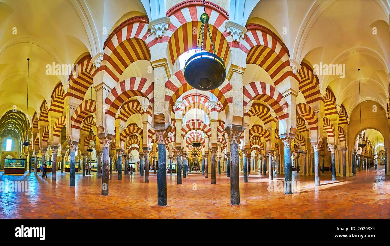 CORDOBA, SPAIN - SEP 30, 2019: Enjoy the panorama of hypostyle hall in Mezquita- Catedral with double arches, antique columns and scenic vault, on Sep Stock Photo