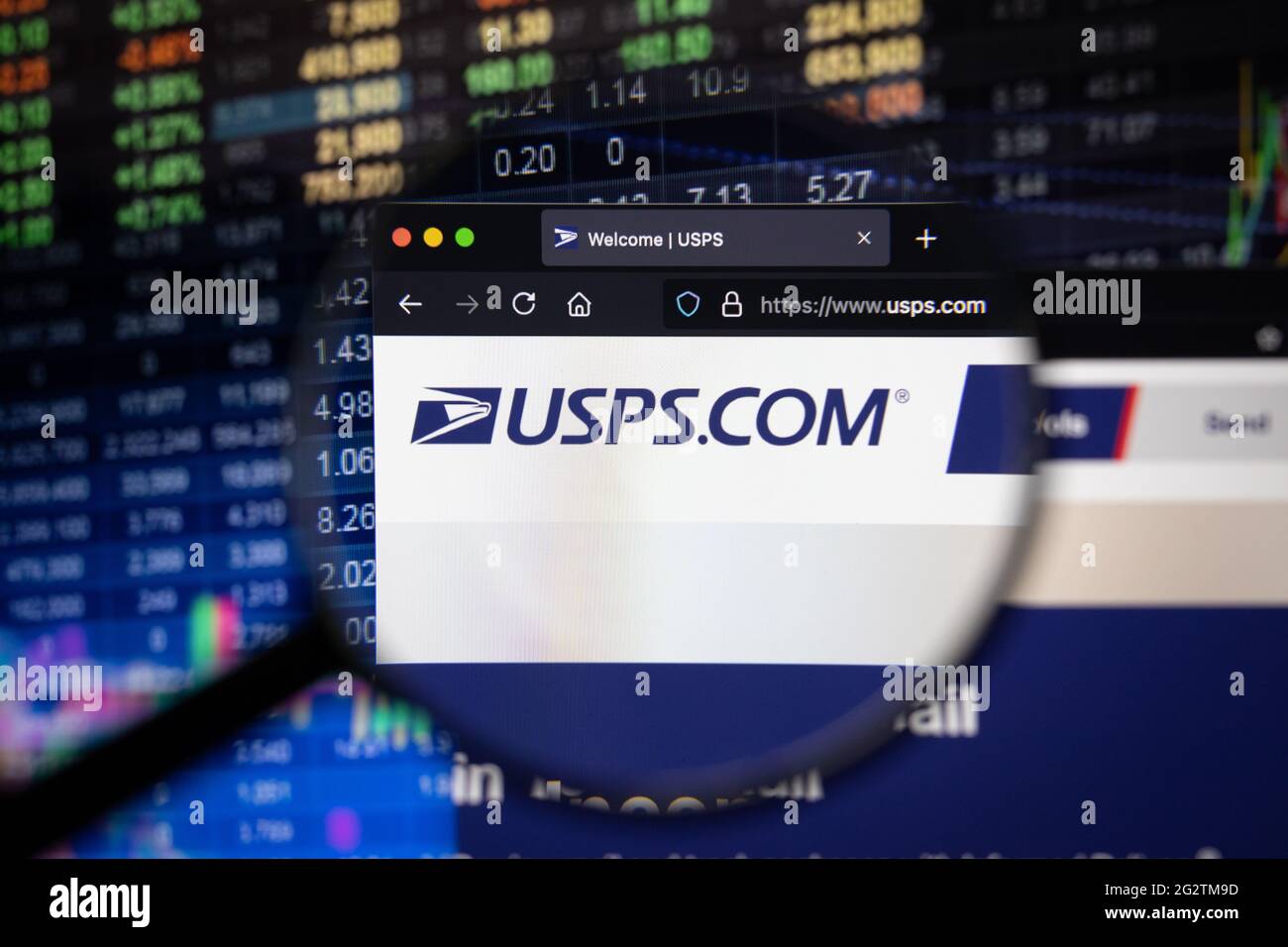 USPS United States Postal Service company logo on a website with blurry stock market developments in the background, seen on a computer screen Stock Photo