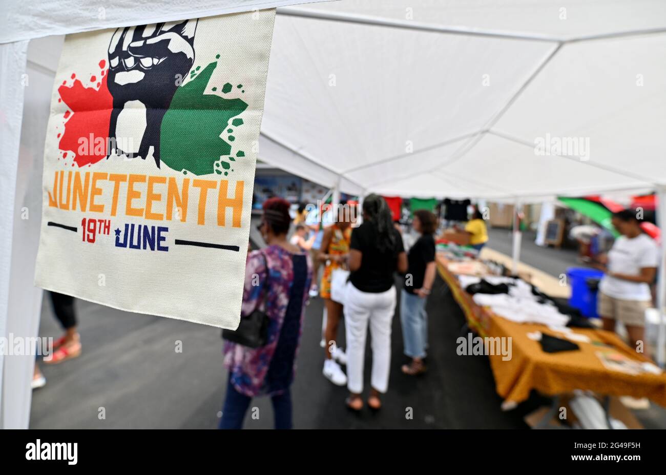 Scranton, United States. 19th June, 2021. A Juneteenth flag hangs on one of the vendor tents during a Juneteenth celebration.President Joe Biden signed into law legislation that would establish June 19 as Juneteenth National Independence Day. Juneteenth is the celebration of the emancipation of blacks. Scranton held a block party for families to celebrate the holiday. Credit: SOPA Images Limited/Alamy Live News Stock Photo