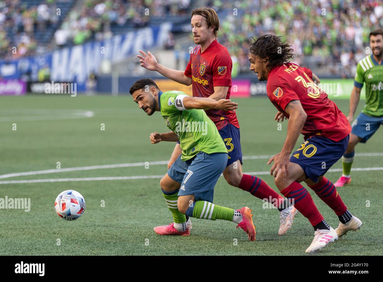 Seattle Sounders midfielder Cristian Roldan (7) controlling the ball against Real Salt Lake midfielder Nick Besler (13) and defender Marcelo Silva (30 Stock Photo