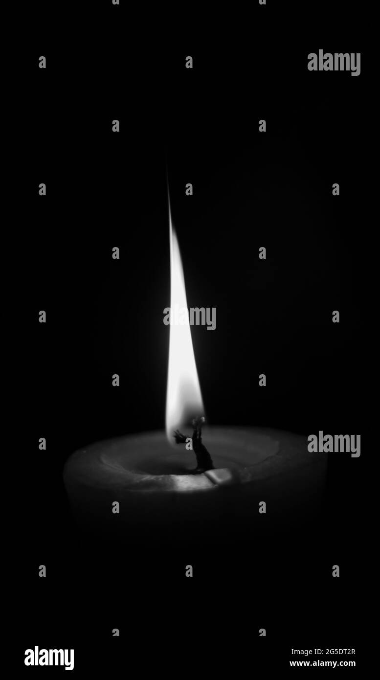 lighting candles, Burning candle on black background, Candle in the dark,  Design for the background and wallpaper. copy space Stock Photo - Alamy