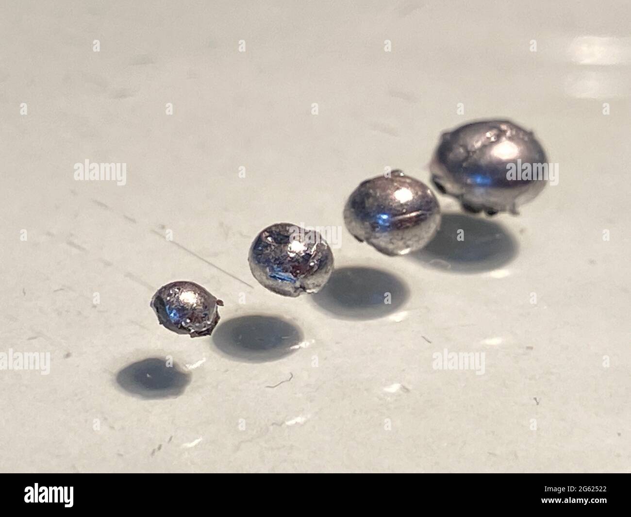 rhodium metal balls, rhodium is more expencive than other other metals Stock Photo