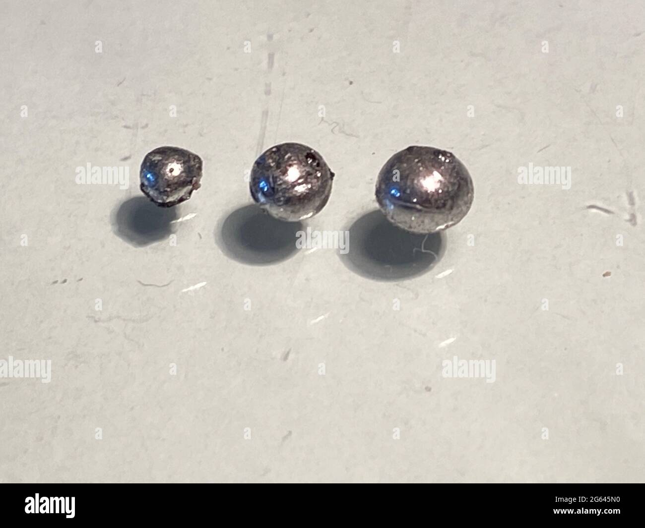 rhodium metal balls, rhodium is more expencive than other other metals Stock Photo