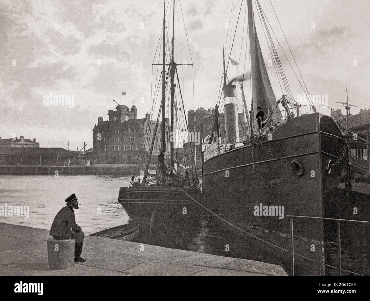 A late 19th century view of a solitary sailor in Leith, a port in the north of the city of Edinburgh, Scotland,  located on the southern coast of the Firth of Forth. It's marine activities included shipbuilding, fishing as an important entrepôt for the Scottish herring trade, and whaling. The latter took place in local, and Icelandic waters (the last whale in the Firth of Forth was caught in 1834. Stock Photo