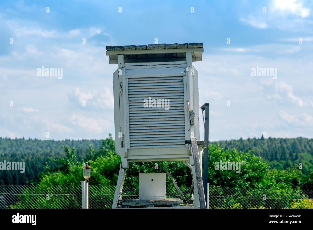 instrument shelter on a weather station with various meteorological instruments inside Stock Photo