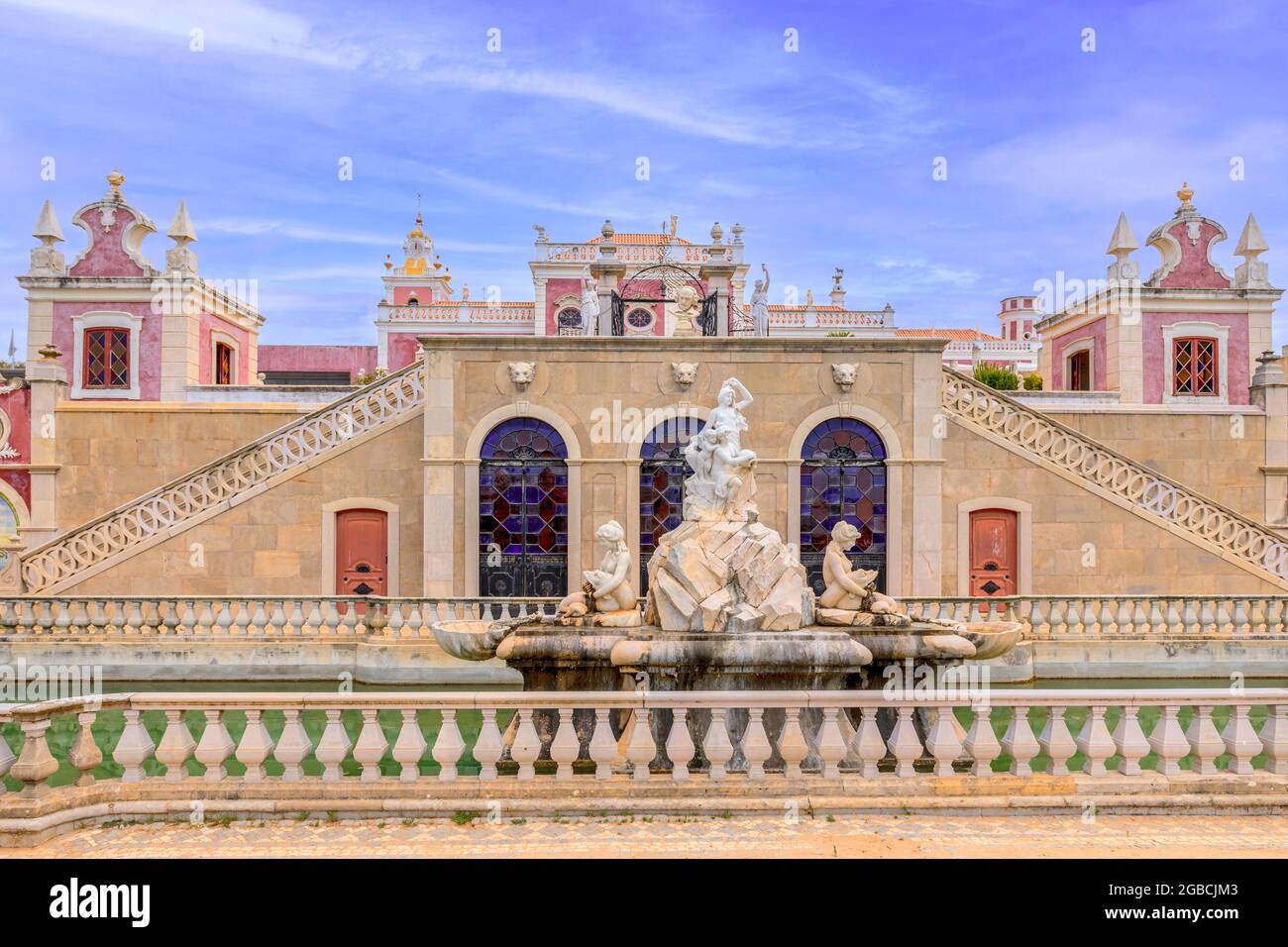 The pink Estoi palace, Palacio De Estoi a fine example of rococo architectue now part of a hotel. Estoi Algarve Portugal Stock Photo