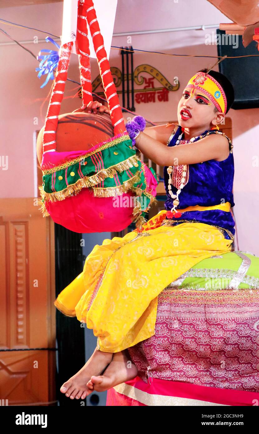 Hansi, haryana, August 2020 : A child rolling Lord Krishna with a pot of butter - Janmashtami concept Stock Photo