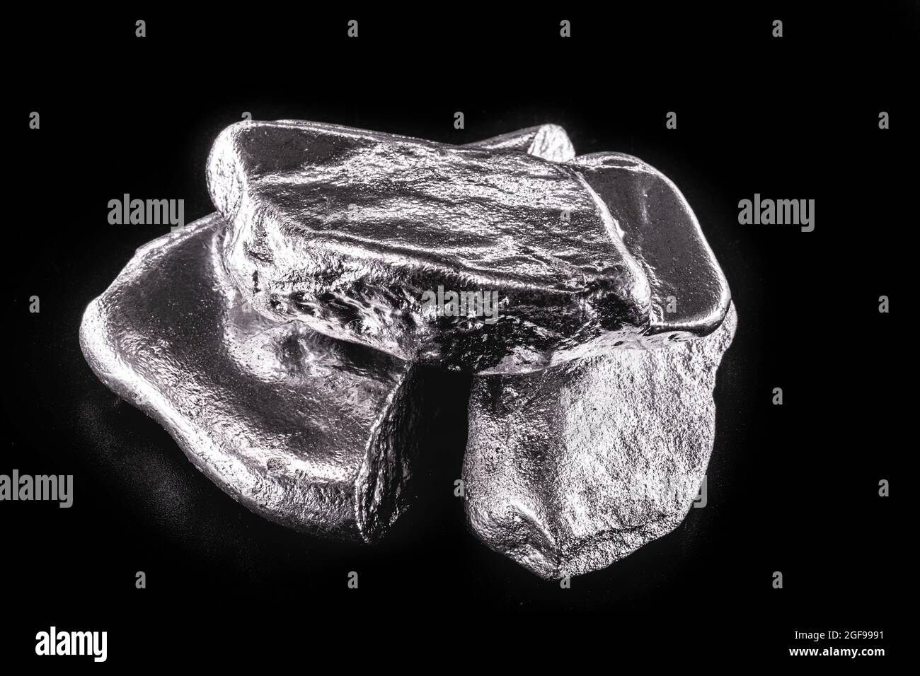 Rhodium nugget, chemical element with Rh symbol, metal for industrial use, used in jewelry and automatic equipment. Stock Photo