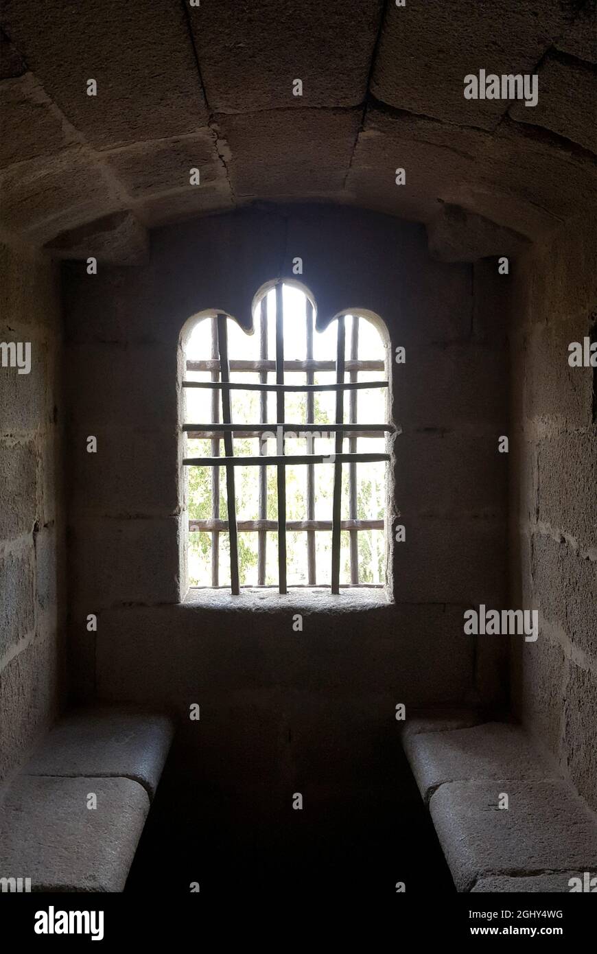 Granadilla castle interior, window with iron fence and old wooden door 2 Stock Photo