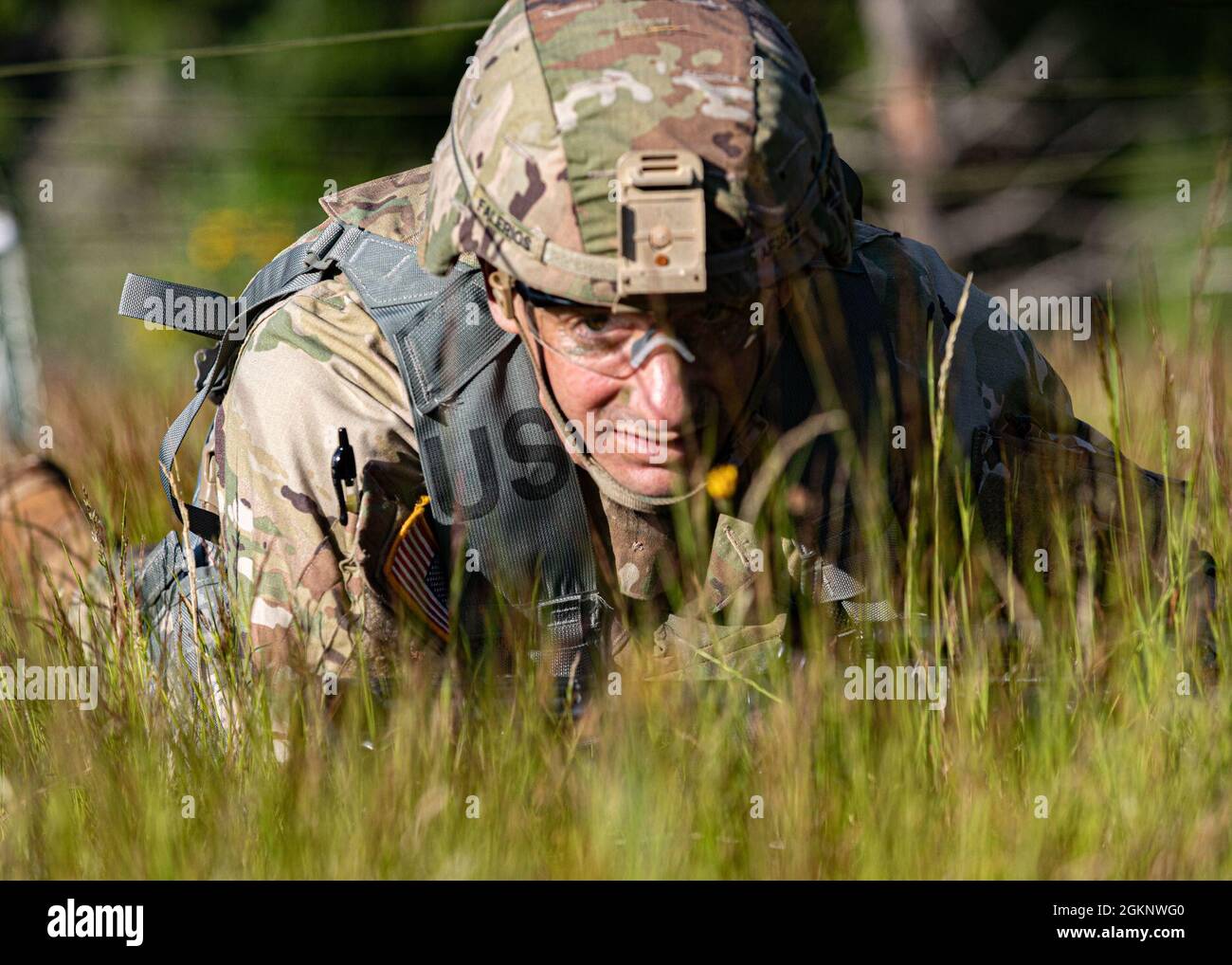 Spc. Austin Falerios, an AH-64 armament/electrical/avionic systems repairer assigned to Bravo Company, 46th Aviation Support Battalion, 16th Combat Aviation Brigade and an Atascadero, Calif., native, moves through the grenade course during the I Corps Best Warrior Competition at Joint Base Lewis-McChord, Wash., June 8, 2021. The competition encompassed four days of grueling tasks designed to test their knowledge, physical and mental endurance, and leadership skills. Stock Photo