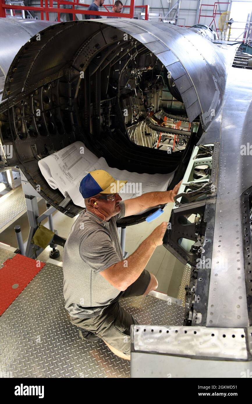 Chet Jones, 561st Aircraft Maintenance Squadron sheet metal mechanic, fits a part for an F-15 Eagle aircraft tail cone at the Warner Robins Air Logistics Complex at Robins Air Force Base, Georgia, June 8, 2021. The 561st AMXS accomplishes inspection, modification, maintenance and repair on F-15 aircraft. Stock Photo