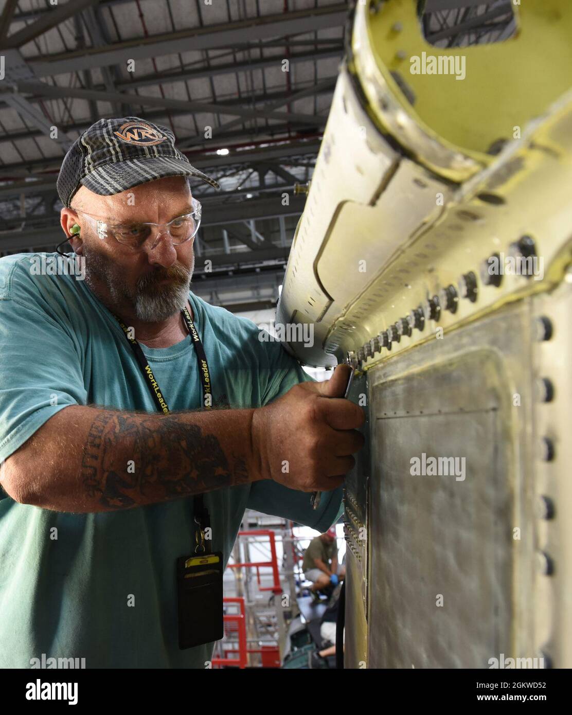 Jerry Bridges, 561st Aircraft Maintenance Squadron sheet metal work lead, installs the cradle of an F-15 Eagle aircraft left vertical at the Warner Robins Air Logistics Complex at Robins Air Force Base, Georgia, June 8, 2021. The 561st AMXS accomplishes inspection, modification, maintenance and repair on F-15 aircraft. Stock Photo