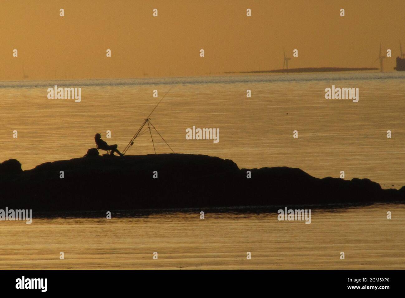 Heysham, Lancashire, United Kingdom. 16th Sep, 2021. the Sun sets behind Heysham Barrows Credit: PN News/Alamy Live News   Stock Photo