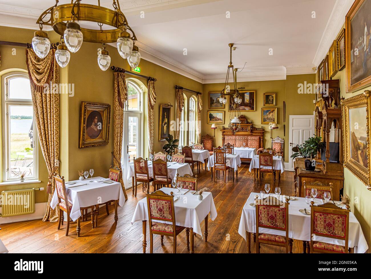 Gourmet restaurant with exquisite empire furniture in the Aarøsund seaside hotel from 1906, Aarosund, Denmark, August 27, 2021 Stock Photo