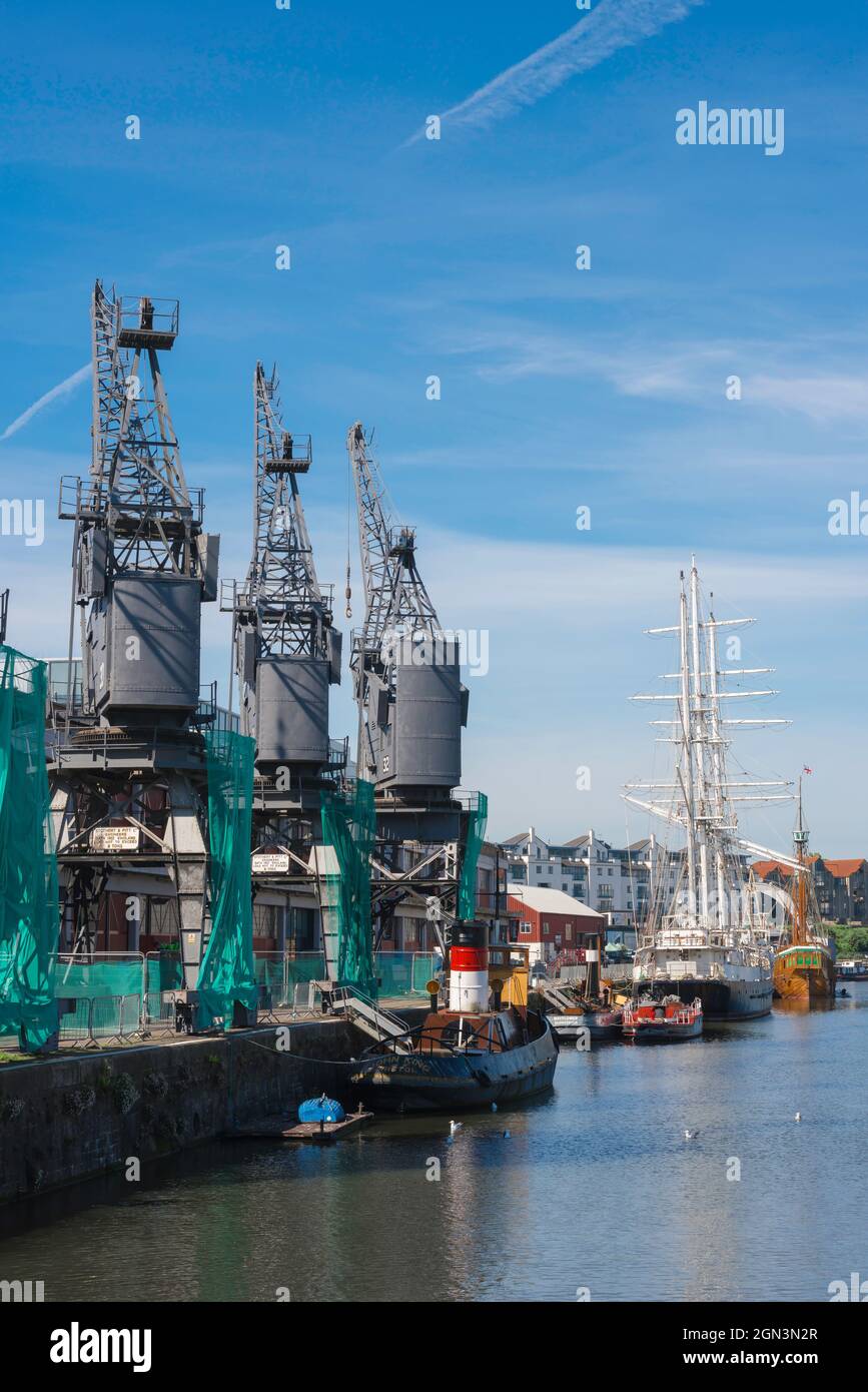 Historic Bristol, view of vintage cranes sited along the quay of the historic Floating Harbour in the centre of Bristol, England, UK Stock Photo