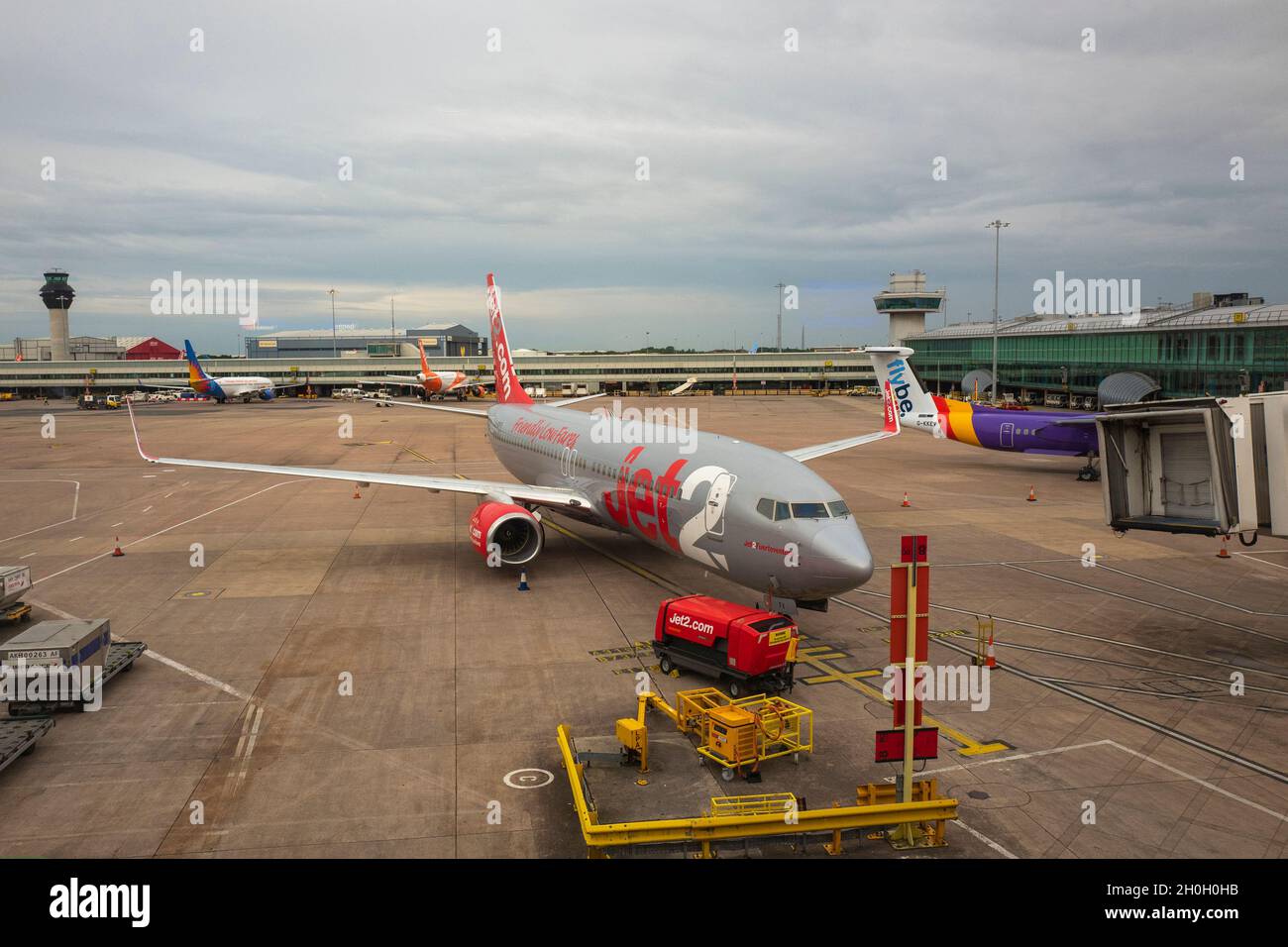 A Jet2 airplane outside a terminal at Manchester Airport on August 04, 2020 in Manchester, England, UK Stock Photo