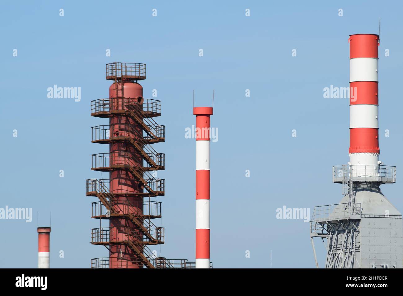 Pipes refinery furnaces and distillation column. The equipment at the refinery. Stock Photo