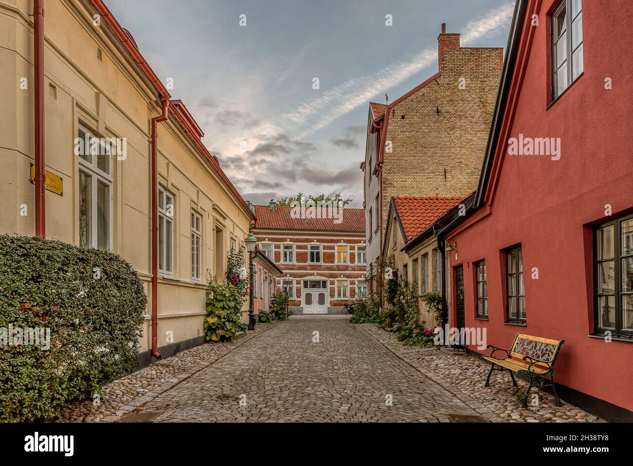 bench on the pavement in an picturesque cobbled street Ystad, Sweden, September 14, 2021 Stock Photo