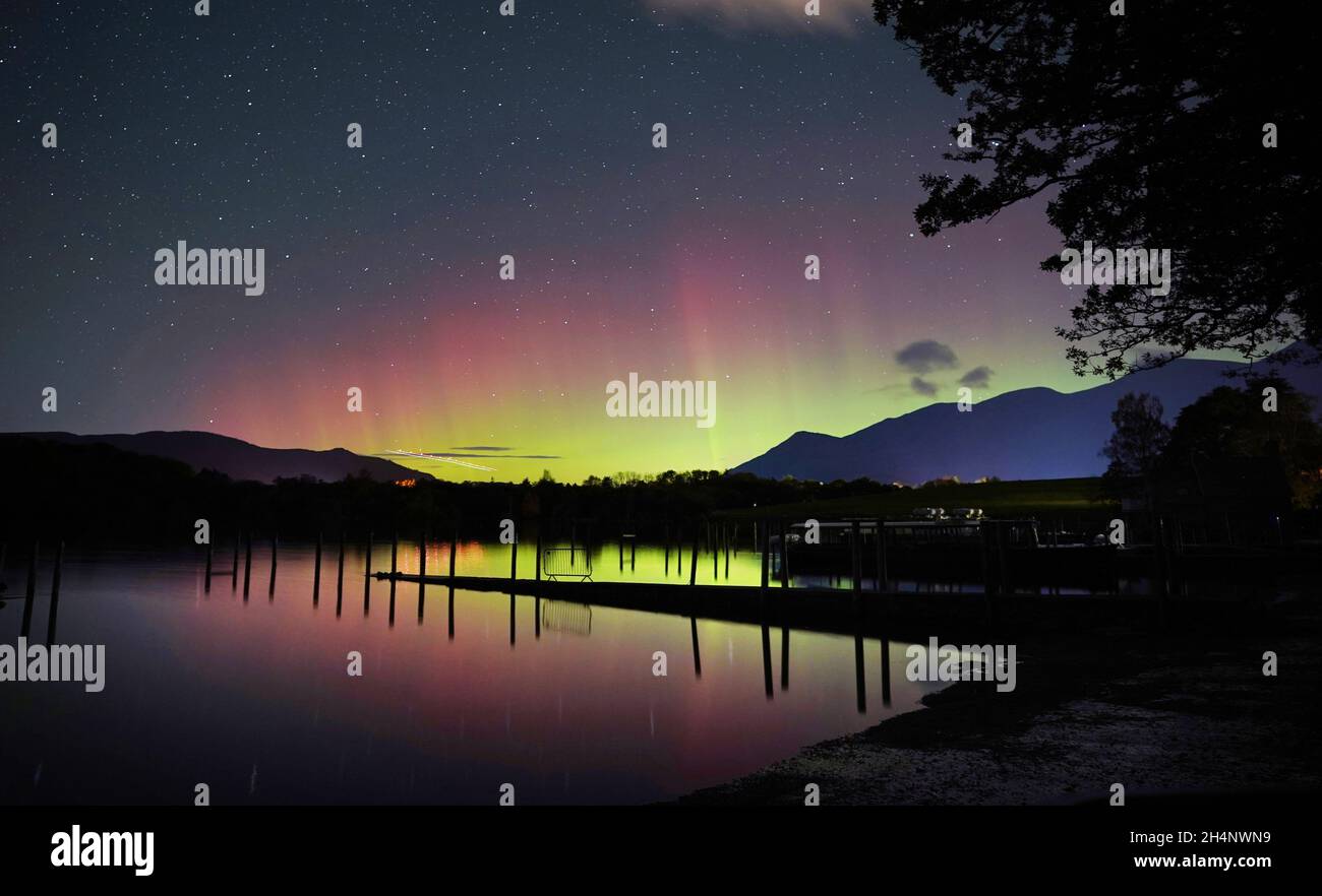 A spectacular display of the Northern Lights seen over Derwentwater, near Keswick in the Lake District, last night and into the early hours of Thursday. Picture date: Thursday November 4, 2021. Stock Photo