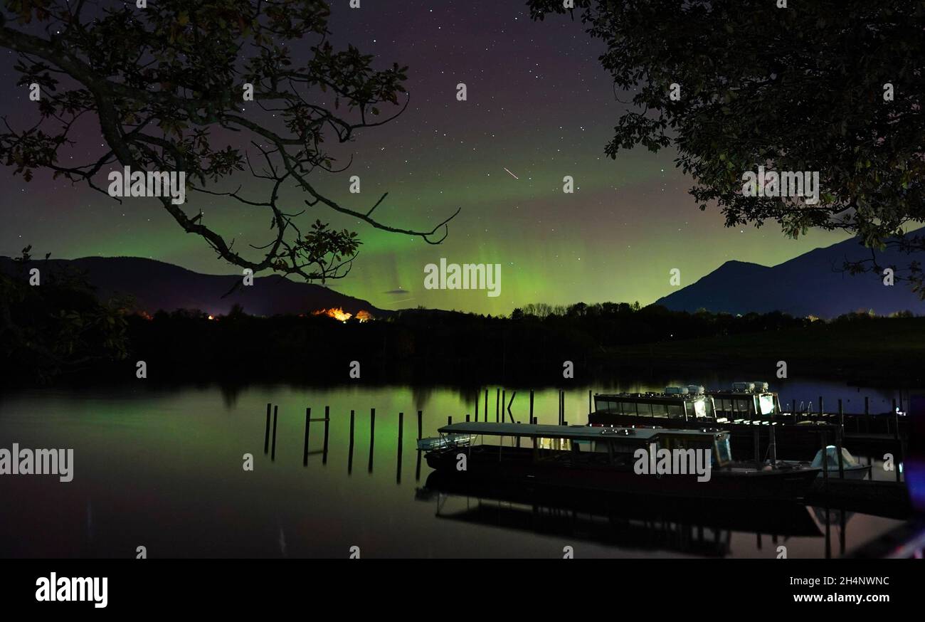 A spectacular display of the Northern Lights seen over Derwentwater, near Keswick in the Lake District, last night and into the early hours of Thursday. Picture date: Thursday November 4, 2021. Stock Photo