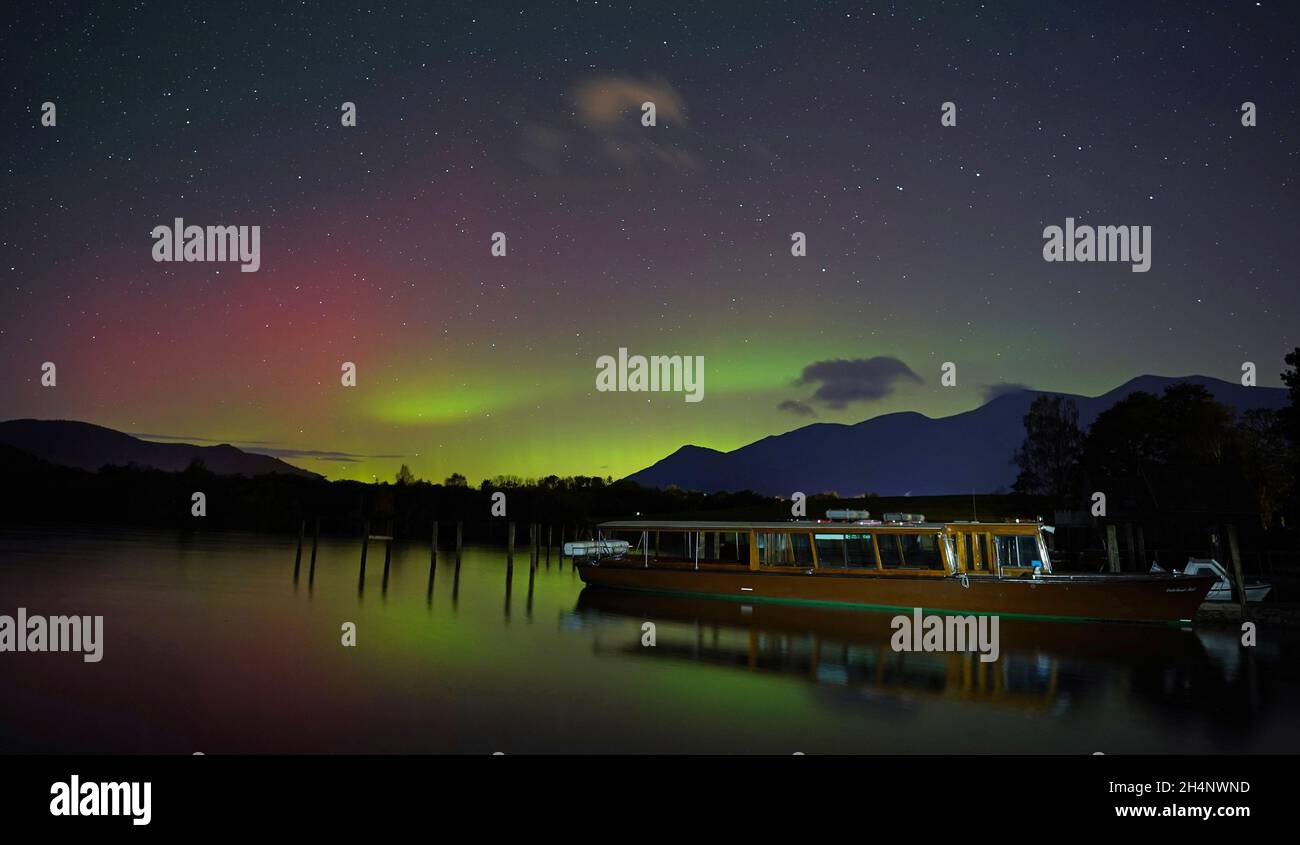 A spectacular display of the Northern Lights seen over Derwentwater, near Keswick in the Lake District, last night and into the early hours of Thursday. Picture date: Thursday November 4, 2021. Stock Photo