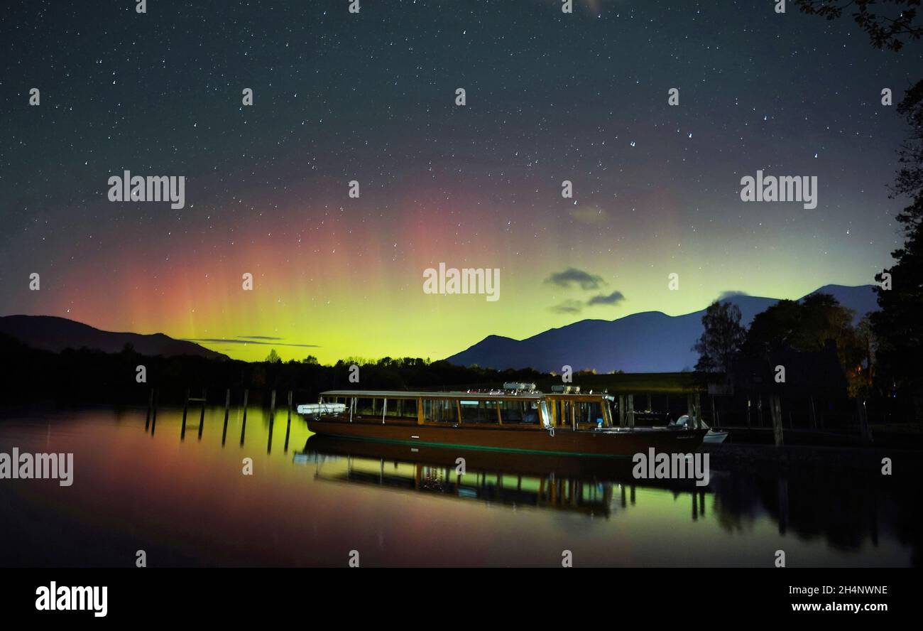 A spectacular display of the Northern Lights seen over Derwentwater, near Keswick in the Lake District, last night and into the early hours of Thursday. Picture date: Thursday November 4, 2021. Stock Photo