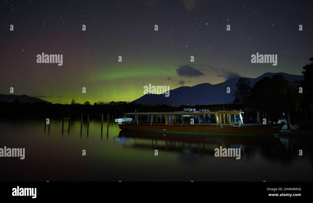 A spectacular display of the Northern Lights seen over Derwentwater, near Keswick in the Lake District, last night and into the early hours of Thursday. Picture date: Thursday November 4, 2021. Stock Photo