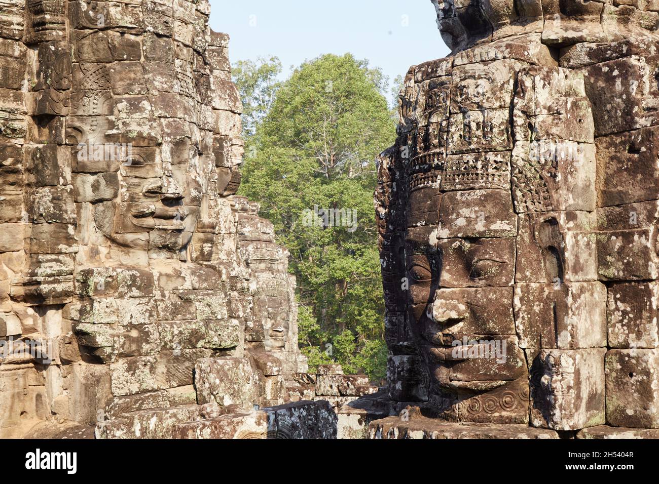 The defining characteristic of the Bayon is its monumental smiling faces, which could either represent Avalokiteshvara or King Jayavarman VII himself Stock Photo