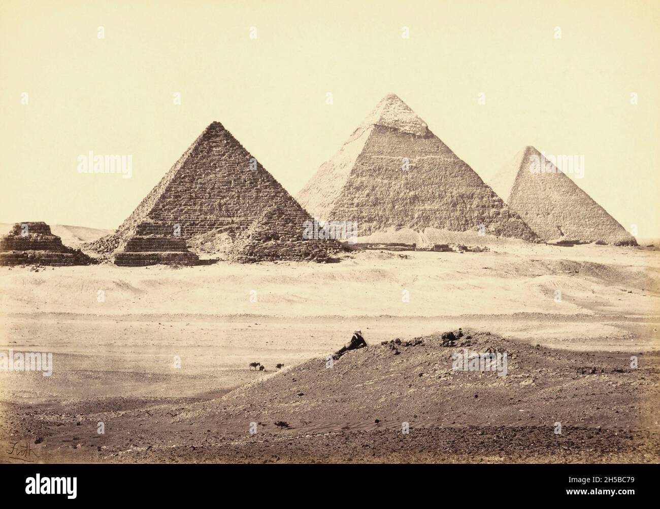 The Giza pyramid complex, at Giza, near Cairo, Egypt, as photographed by English photographer Francis Frith in the mid 19th century.  From left to right: Pyramid of Khufu (known as the Great Pyramid), the Pyramid of Khafre and the Pryamid of Menkaure.  The pyramids are now part of a UNESCO World Heritage Site. Stock Photo