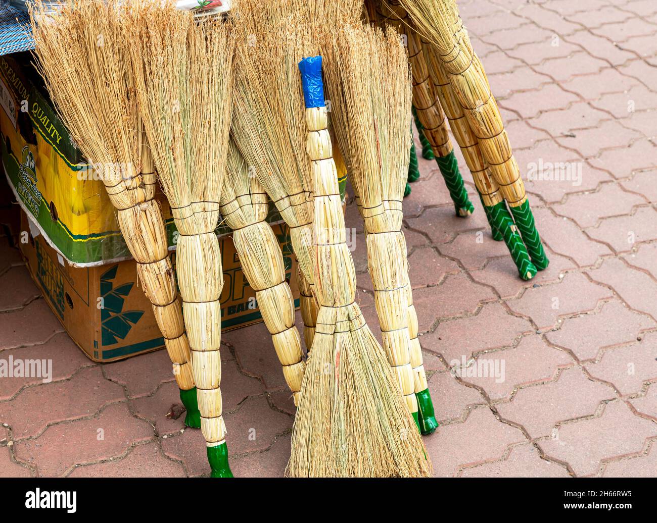 Novgorod, Russia- September, 15, 2021: Brooms made from sorghum a sold at the local market. Environmentally friendly goods Stock Photo