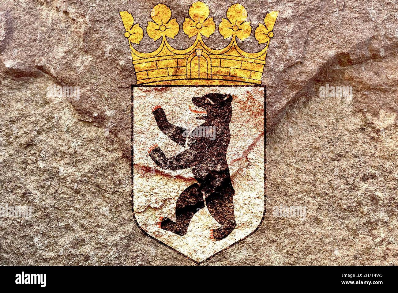 Faded Coat of arms of Berlin isolated on weathered solid rock wall background Stock Photo