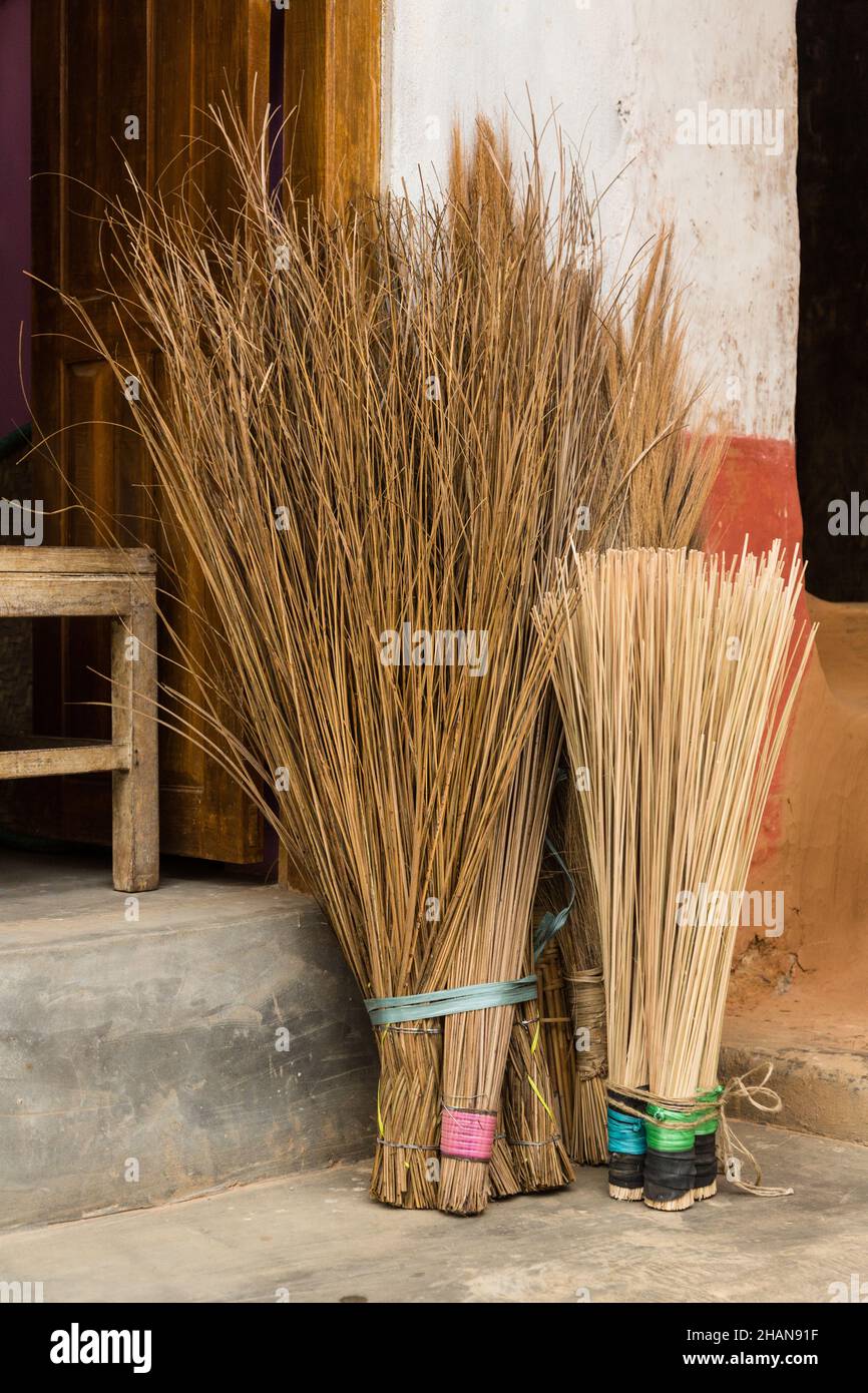 Natural brooms made from plant stems for sale on the street in the medieval Newari village of Bandipur, Nepal. Stock Photo