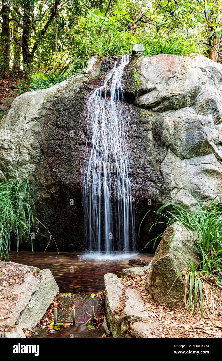 man-made waterfall in the park recreation area Stock Photo