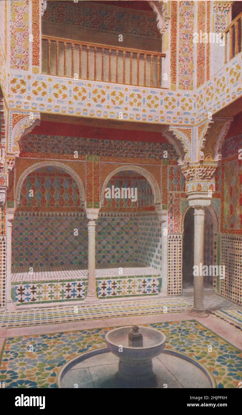 Tile, Mosaics, intricate tracery and Moslem inscriptions colour the Sala de Reposo of the Royal Baths in the Alhambra. Spain. Andalusia (1923) Stock Photo