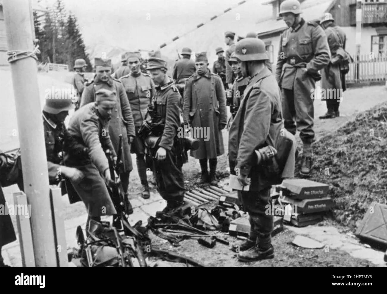 YUGOSLAV SOLDIERS surrender their arms to German soldiers about 1941. Stock Photo