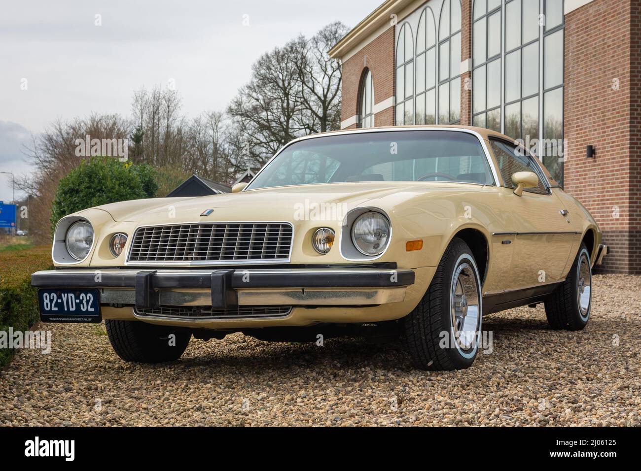 Brummen, Province Gelderland, The Netherlands, 12.03.2022, Classic car Chevrolet Camaro 1975 in yellow colour, second generation of the model Stock Photo