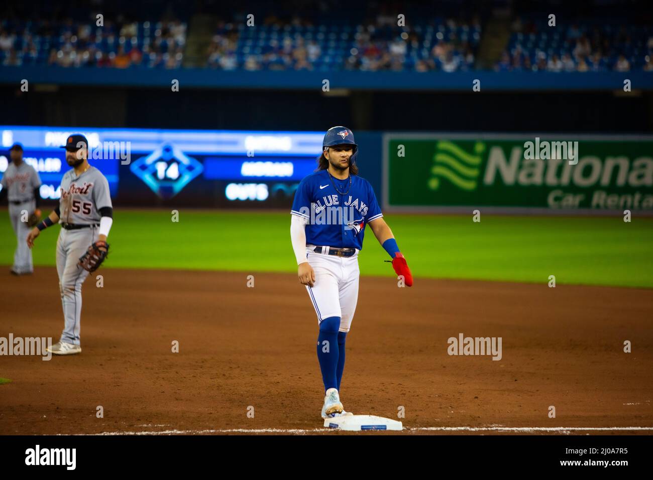 Toronto Blue Jays Shortstop Bo Bichette stands at first base at Rogers Centre with Detroit Tigers players in the background Stock Photo