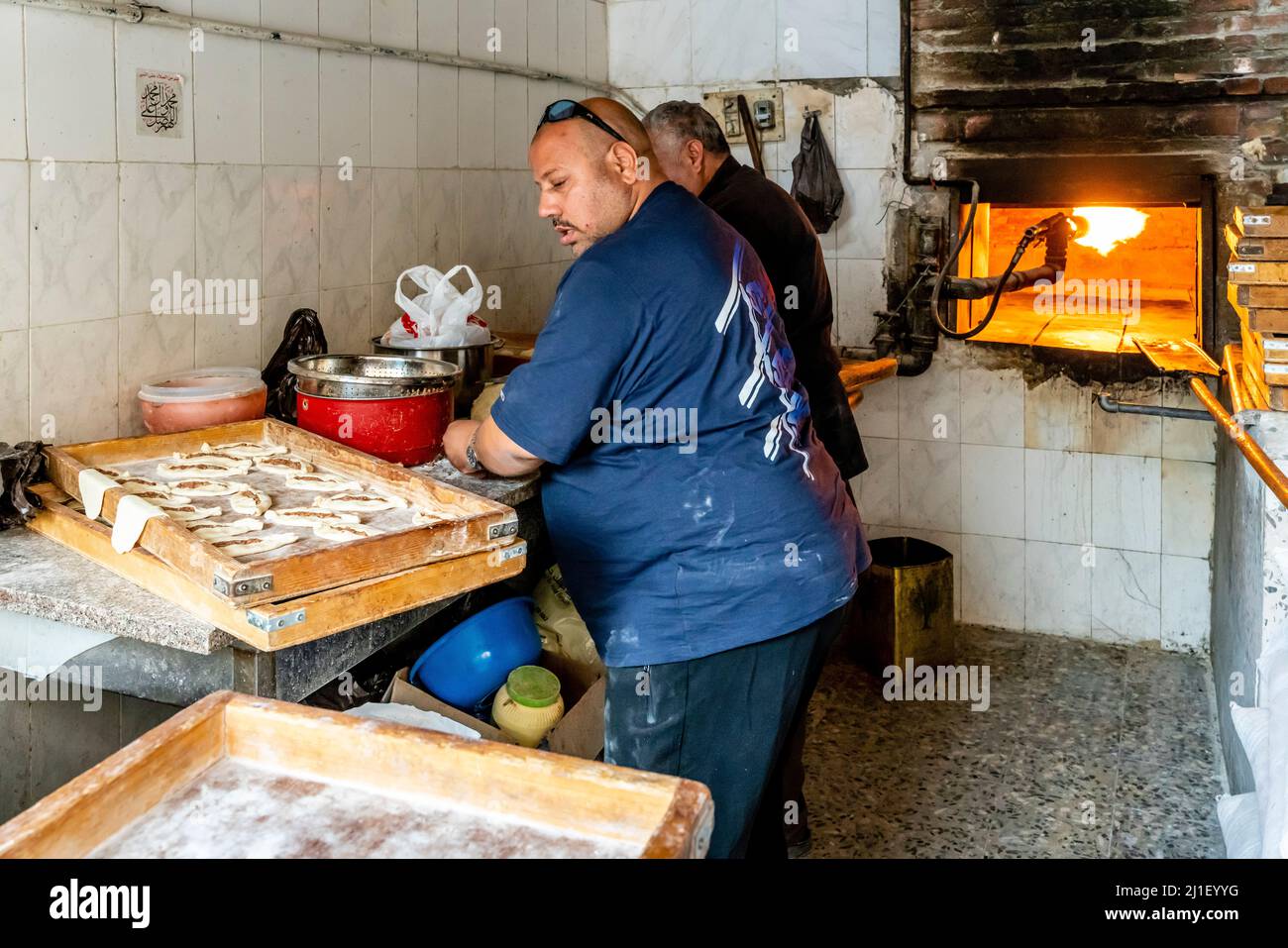 Men Working In A Traditional Arab Bakery, Madaba, Madaba Governorate, Jordan. Stock Photo