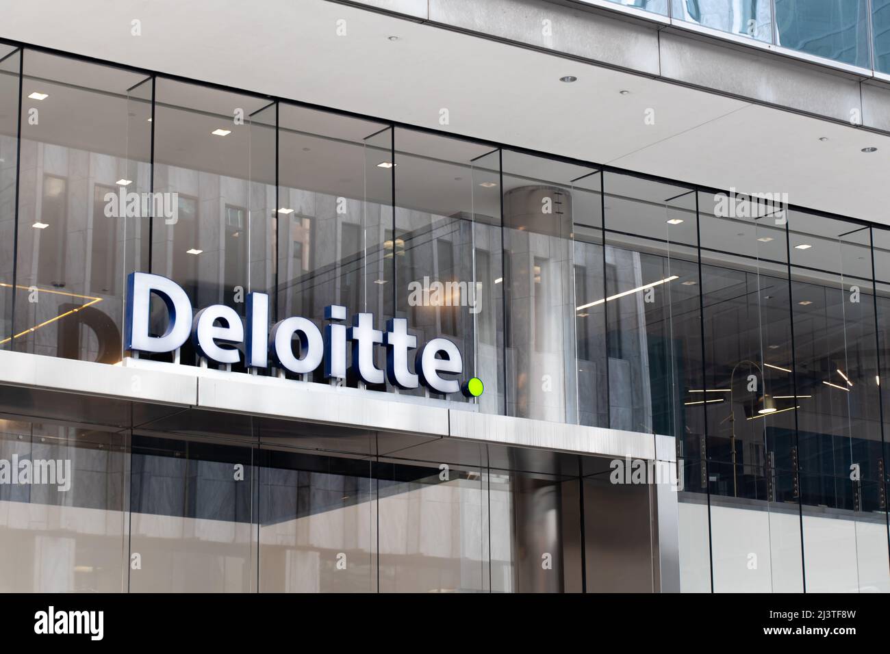 The Deloitte logo, a professional services firm, is seen at the front of their office in Toronto. Stock Photo