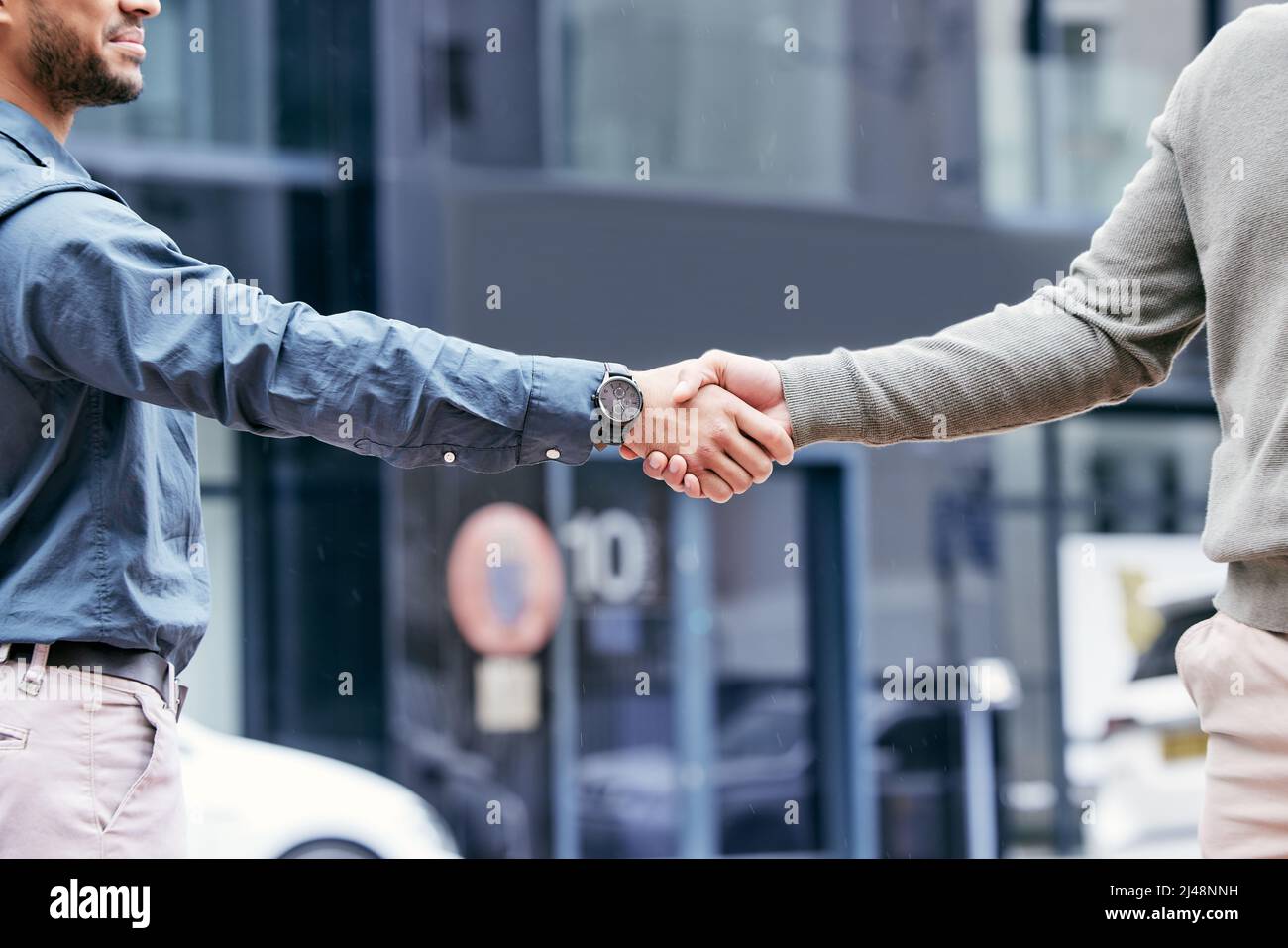 Dont judge each day by the harvest you reap. Shot of two unrecognizable businesspeople shaking hands. Stock Photo