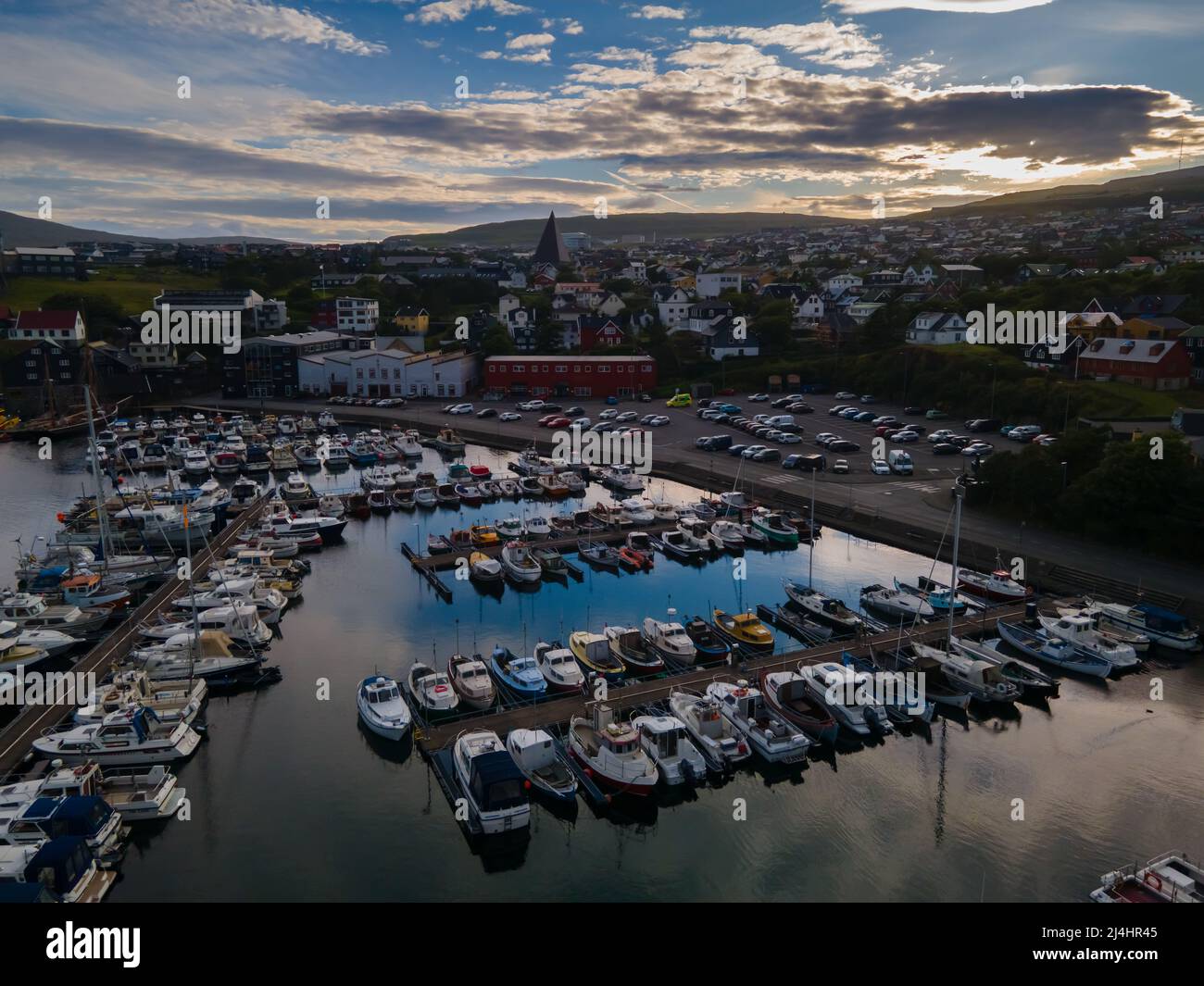 Beautiful aerial view of the City of Torshavn Capital of Faroe Islands- View of Cathedral, colorful buildings, marina, suburbs and Flag Stock Photo